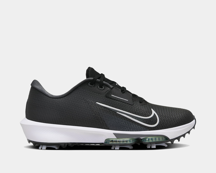 Nike Infinity Tour 2 golf shoes in black and white with a knit upper, visible Zoom Air units, and spiked sole, side view.
