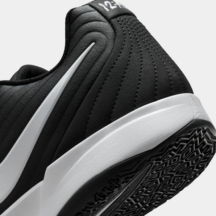 Nike Ja 2 basketball shoes in black with a white sole, quilted detailing, and textured rubber outsole, close-up heel view.