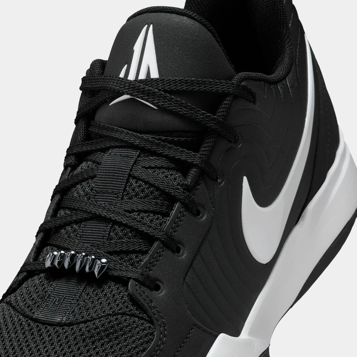 Nike Ja 2 basketball shoes in black and white with mesh upper, textured overlays, lace detailing, and side logo, close-up view.