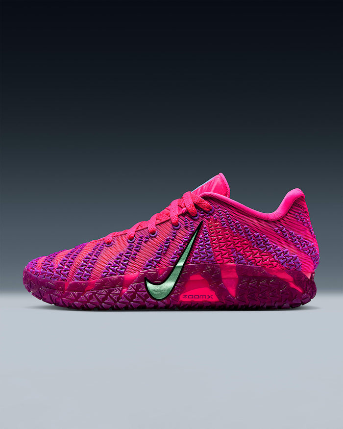 Nike Ja 3 "Price of Admission" basketball shoe in vibrant pink and purple with green metallic Swoosh and textured midsole, side view.
