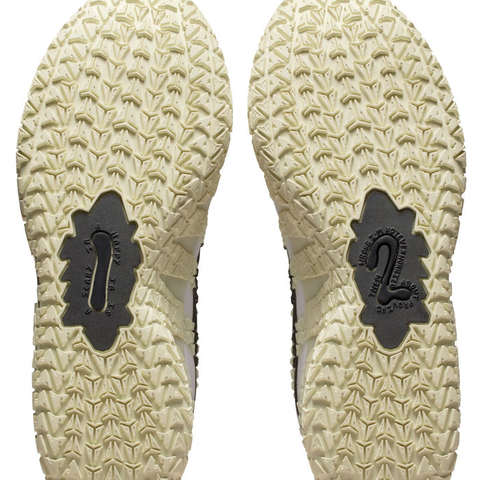 Nike Ja 3 "Sail" basketball shoes outsole with unique textured traction pattern in light beige rubber, bottom view.