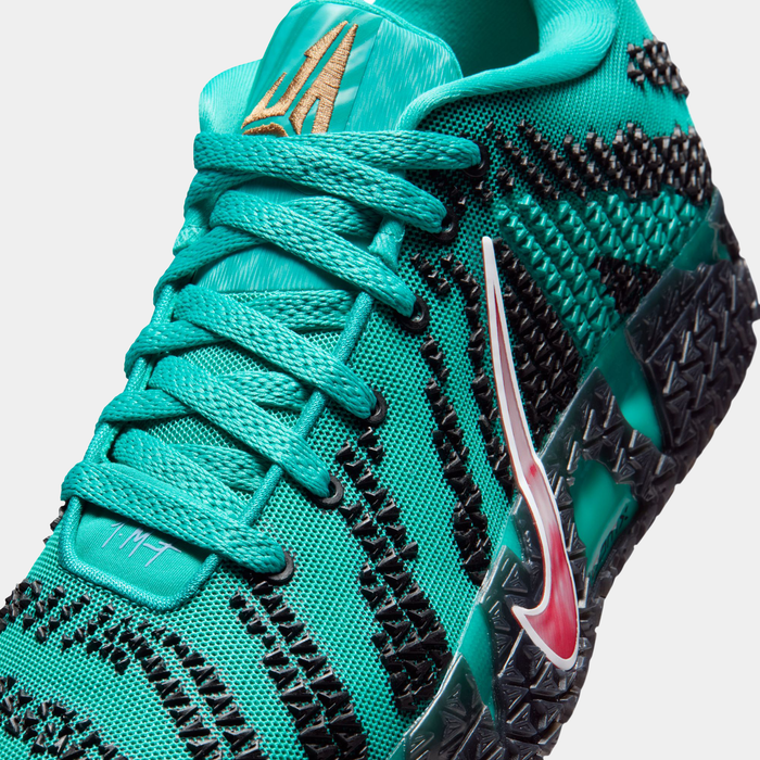 Nike Ja 3 "Scratch 3.0" basketball shoes in teal with black and pink accents, mesh upper, dynamic pattern, and textured midsole, close-up view.
