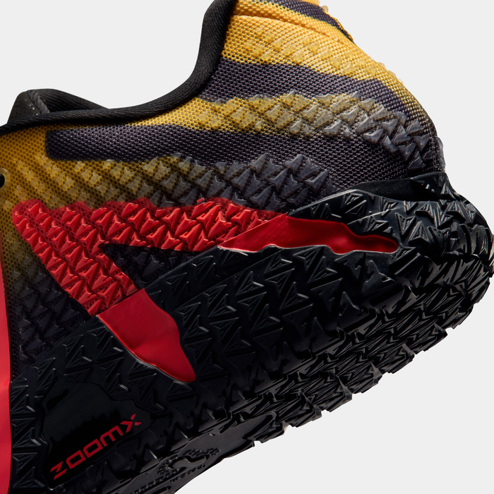 Nike Ja 3 x Jurassic Park "Raptor" basketball shoe featuring a textured yellow, black, and red upper with a bold red midsole design and a black rugged outsole, side view.