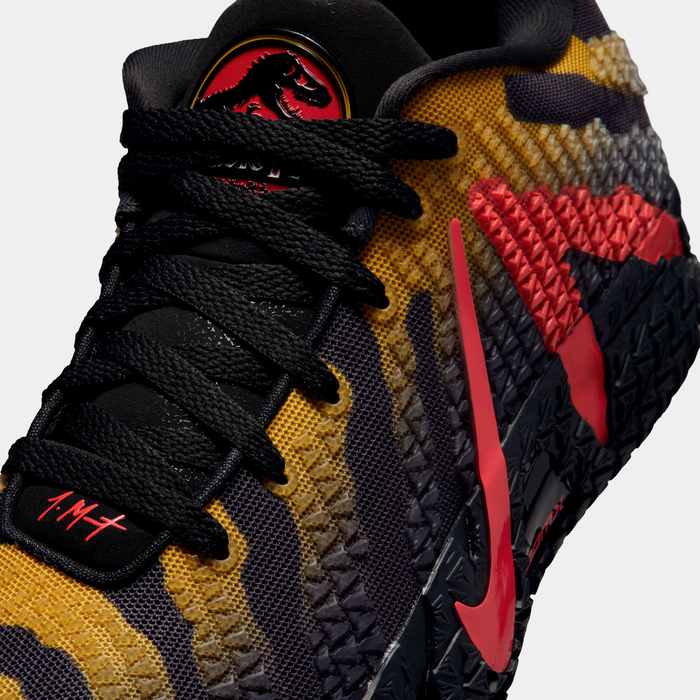 Nike Ja 3 x Jurassic Park "Raptor" basketball shoes featuring a yellow and black patterned mesh upper with red dinosaur-inspired accents, side view.