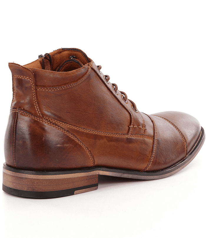 Steve Madden Jabbar short boots in brown suede with stitched panel details and a wood-textured sole, side view.