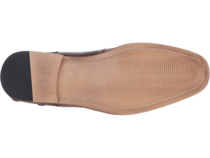 Steve Madden Jagwar dress shoe outsole in tan leather with black heel cap and stitched detailing.