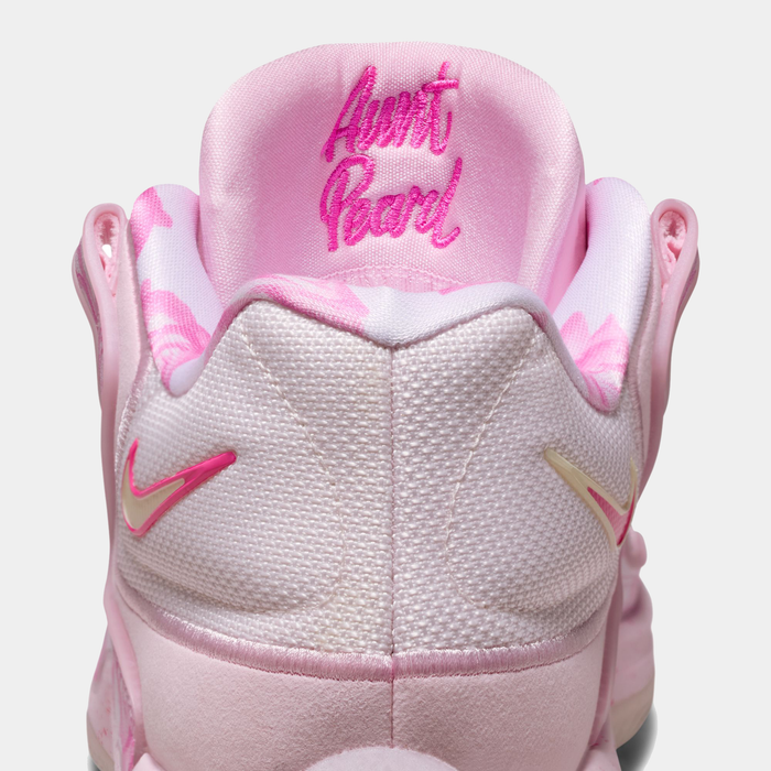 Nike KD 18 "Aunt Pearl" basketball shoes in pink and white with textured mesh upper, floral accents, and embroidered tongue detail, back view.