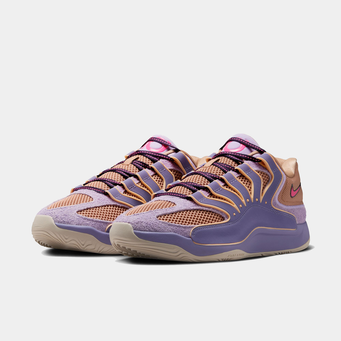 Nike KD 18 basketball shoes in purple, peach, and pink with mesh upper, suede overlays, and rubber outsole, front angle view.