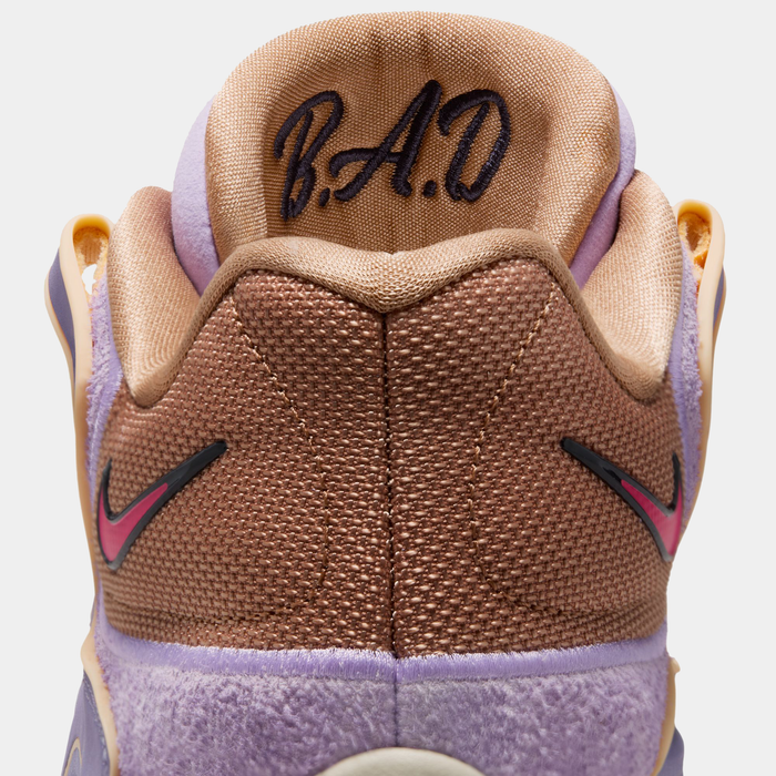 Nike KD 18 basketball shoes back view showing brown mesh heel with embroidered "B.A.D." lettering, purple accents, and pink Nike Swoosh.