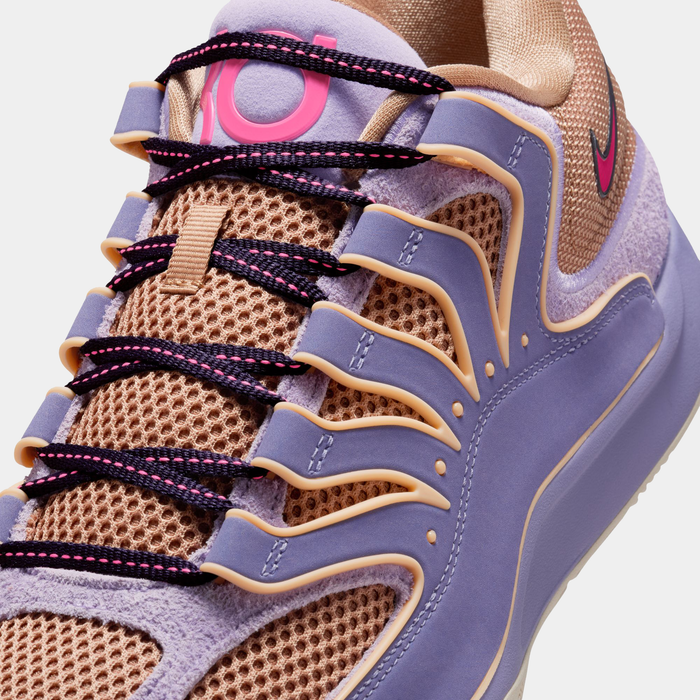 Nike KD 18 basketball shoes featuring beige mesh upper, purple overlays, black laces with pink accents, and KD logo detail, close-up view.