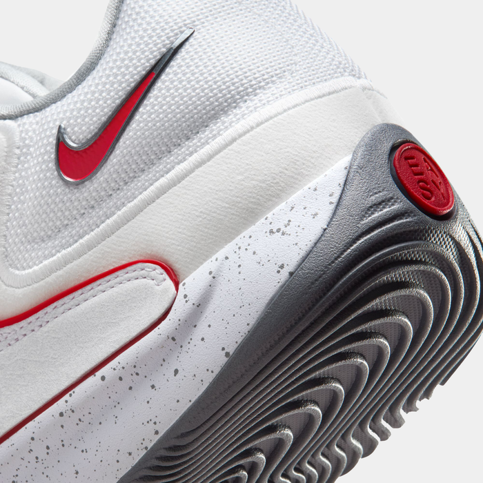 Nike KD18 "Wayne" basketball shoes featuring white mesh upper, red logo detailing, speckled midsole, and grooved gray outsole, close-up side view.