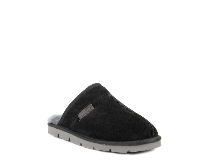 SuperLamb Khulan slippers in black suede with cozy gray lining and durable gray sole, angled front view.