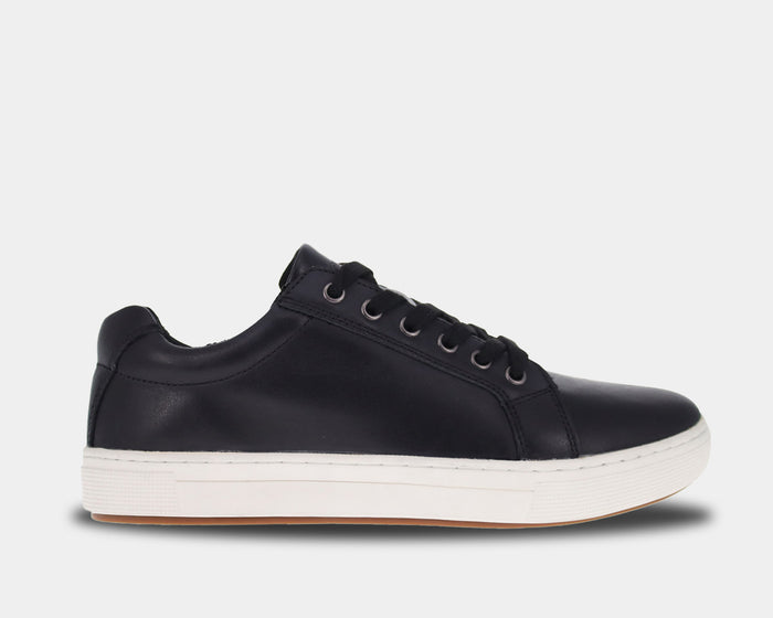 Propét Koda casual sneakers in black leather with white rubber outsole and secure lace-up design, side view.
