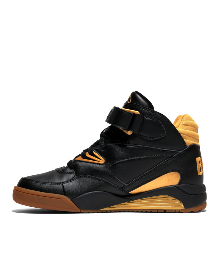 Ewing Athletics KROSS X "BIG L" sneakers in black leather with gold accents and gum outsole, side view.