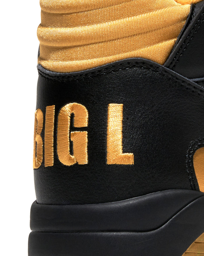 Ewing Athletics KROSS X "BIG L" sneakers heel view with black leather upper and gold embroidered "BIG L" lettering.