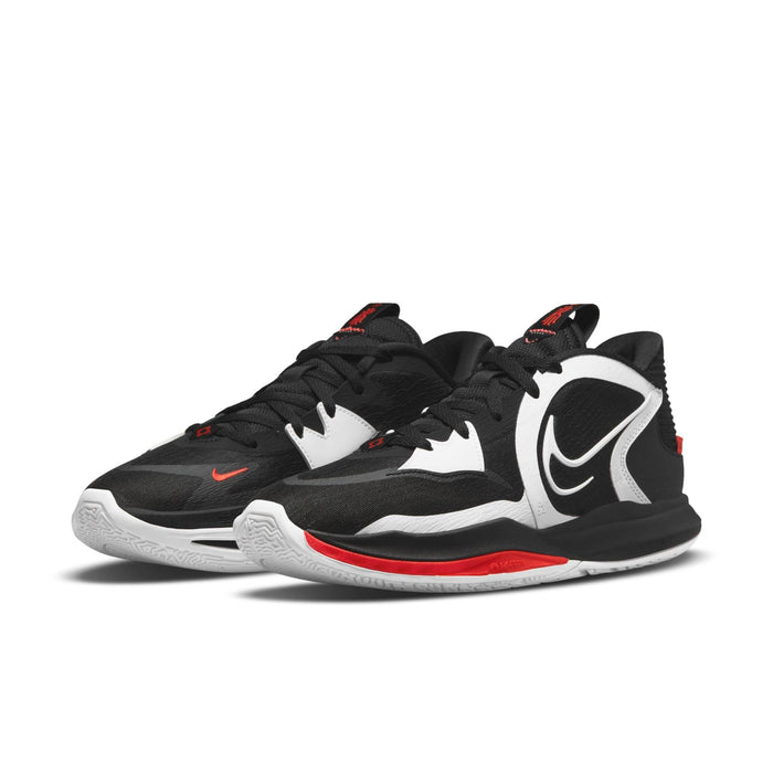 Nike Kyrie Low 5 basketball shoes in black, white, and red with mesh upper, bold Nike swoosh, and cushioned midsole, angled front view.