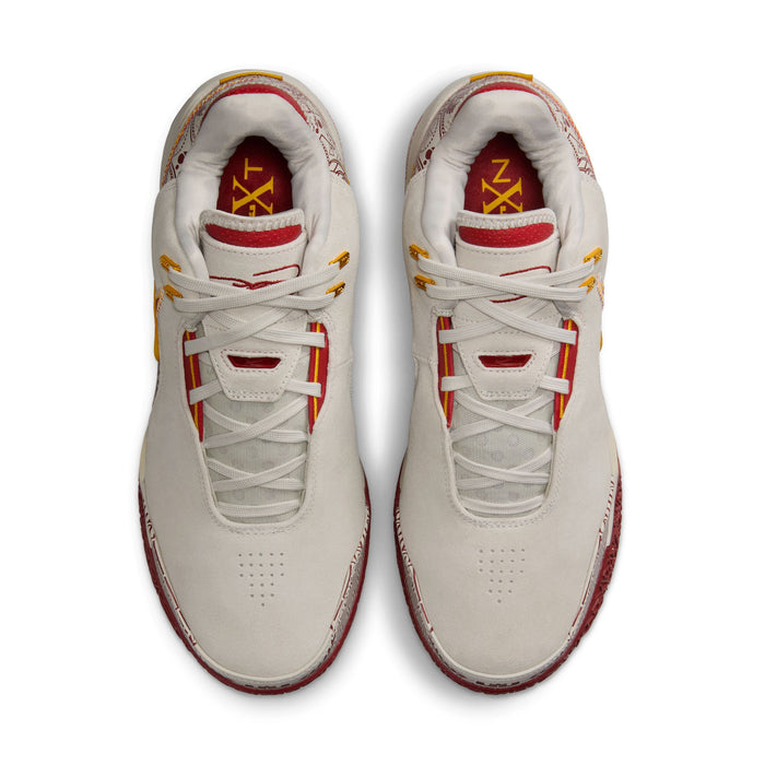 Nike LeBron NXXT Gen AMPD basketball shoes in white with red and yellow accents, breathable mesh upper and lace-up closure, top view.