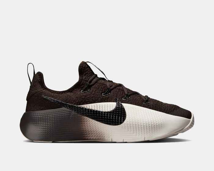 Brown and white sneaker with Nike logo on a light gray background