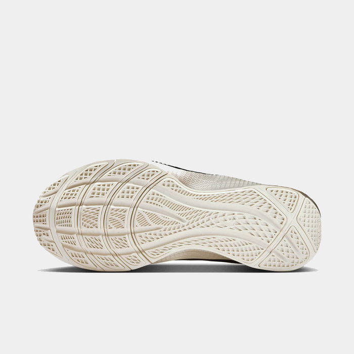 Close-up of a white sneaker sole on a light gray background