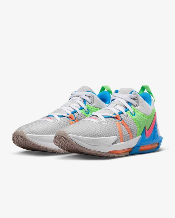 Nike LeBron Witness 7 basketball shoes in white with vibrant green, blue, and coral accents, featuring a mesh upper and cushioned midsole, front angle view.