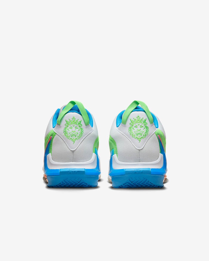 Nike LeBron Witness 7 basketball shoes back view featuring white mesh upper with green lion emblem and blue outsole detailing.