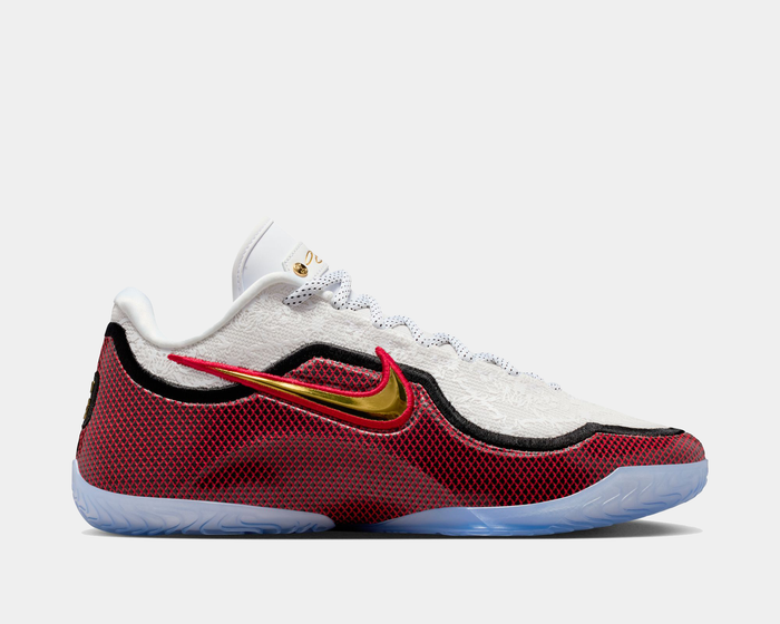 Nike LeBron XXIII "Grand Opening" basketball shoes side view, featuring red mesh overlay, white textured upper, gold metallic swoosh, and translucent outsole.