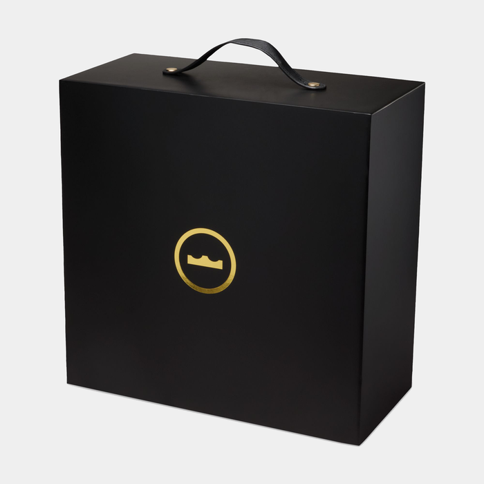 Nike LeBron XXIII "Grand Opening" packaging box in sleek black with gold LeBron crown logo and leather carrying handle.