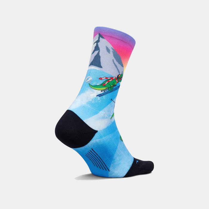 Feetures Limited Edition "Ski-Rex" Elite Light Cushion Mini Crew socks with a vibrant skiing dinosaur design in blue, side view.