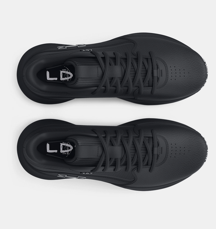 Under Armour Lockdown 7 basketball shoes in black with lace-up design and padded collar, top view.