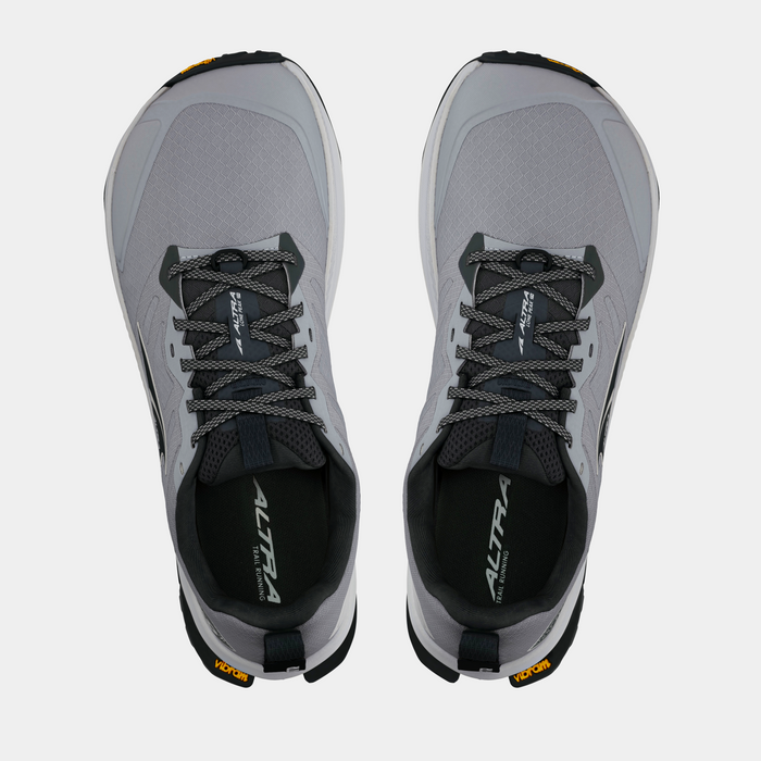 Altra Lone Peak 9+ trail running shoes in light gray with a mesh upper, dark gray laces, and Vibram outsole, top view.