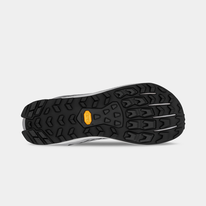 Altra Lone Peak 9+ trail running shoes outsole with Vibram Megagrip rubber and multi-directional lugs, bottom view.