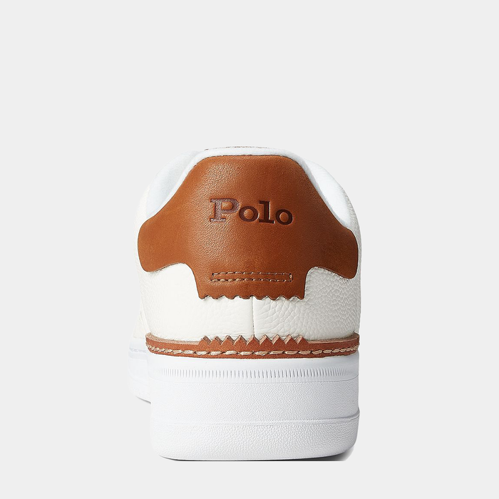 Polo Ralph Lauren Masters Court Leather sneakers back view featuring white textured leather upper, brown leather heel tab with embossed logo detailing, and white rubber sole.