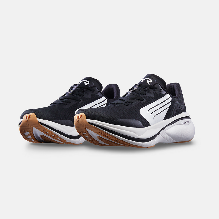 TYR Maverick V1 Runner running shoes in black with white accents, breathable mesh upper, and cushioned midsole, angled front view.