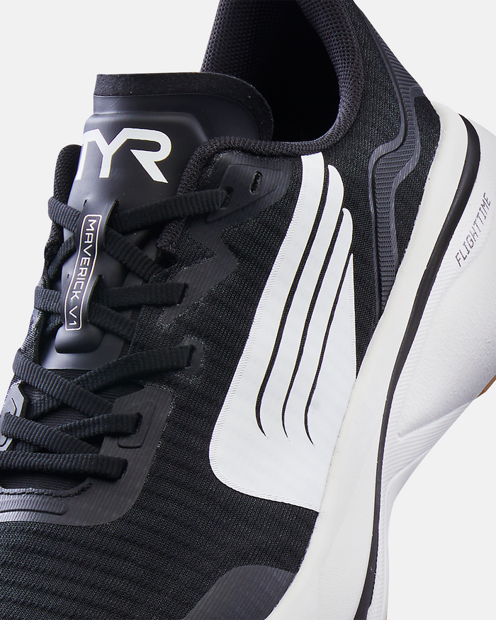 TYR Maverick V1 Runner shoes in black with white accents, mesh upper, and FlightTM cushioning, close-up side view.