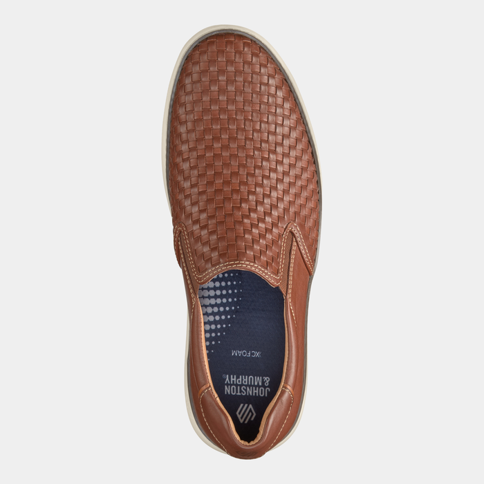 Johnston & Murphy McGuffey 2 Woven Slip-on shoes featuring a brown woven leather upper with elastic gussets and cushioned insole, top view.