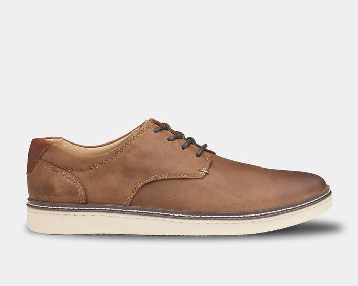 Johnston & Murphy McGuffey Plain Toe casual shoes in tan leather with contrast stitching and white rubber outsole, side view.
