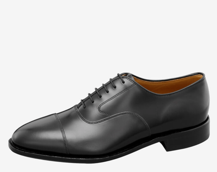 Johnston & Murphy Melton Cap Toe dress shoes in black leather with classic cap toe design and lace-up closure, side view