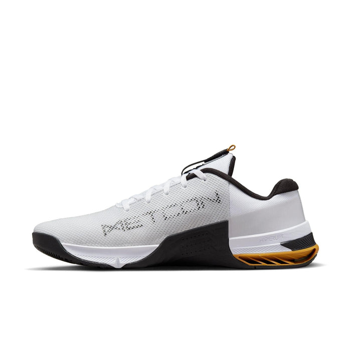 Nike Metcon 8 training shoes in white with black and yellow accents, breathable mesh upper and HyperLift heel support, side view.