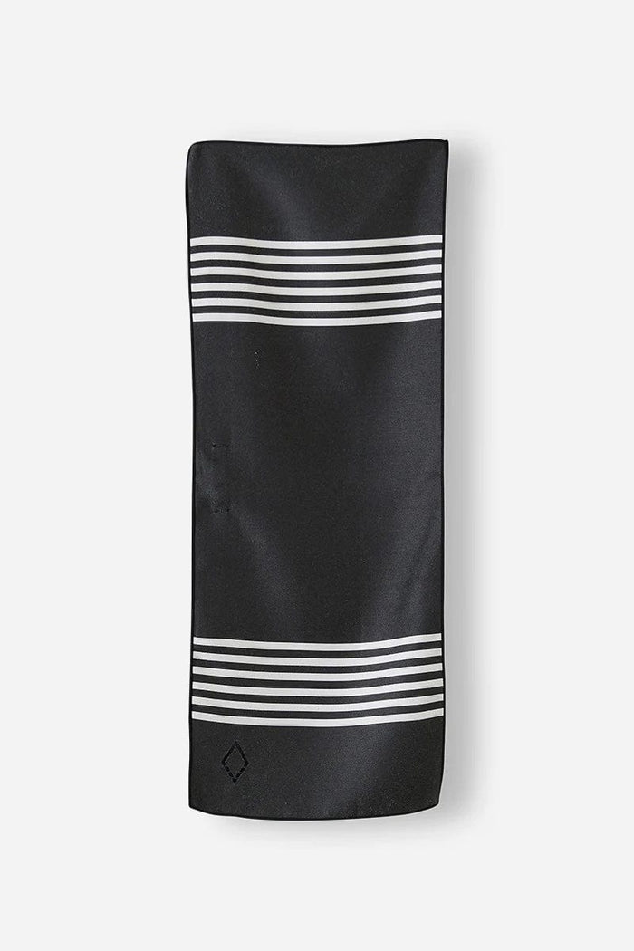 Nomadix Mini Towel in black with white horizontal stripe accents, lightweight and compact design, flat front view.