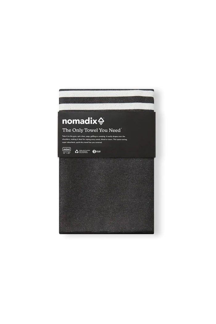 Nomadix Mini Towel in black with subtle texture and white stripe accents, compact design and eco-friendly materials, front view.