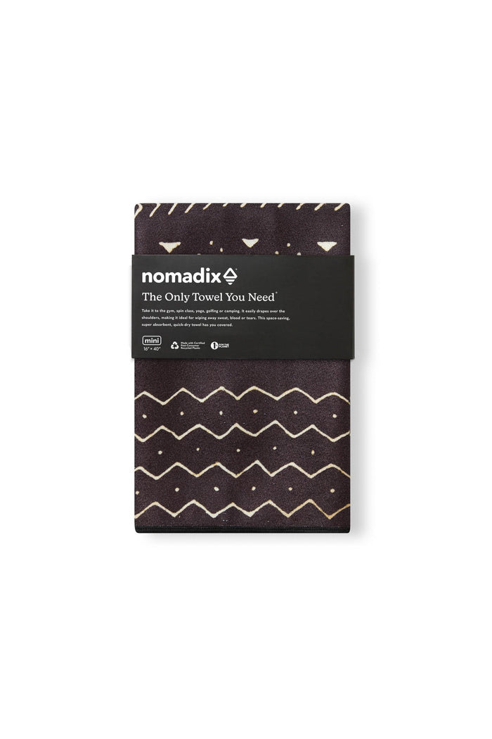 Nomadix Mini Towel in dark brown with beige geometric pattern and compact design, folded front view.