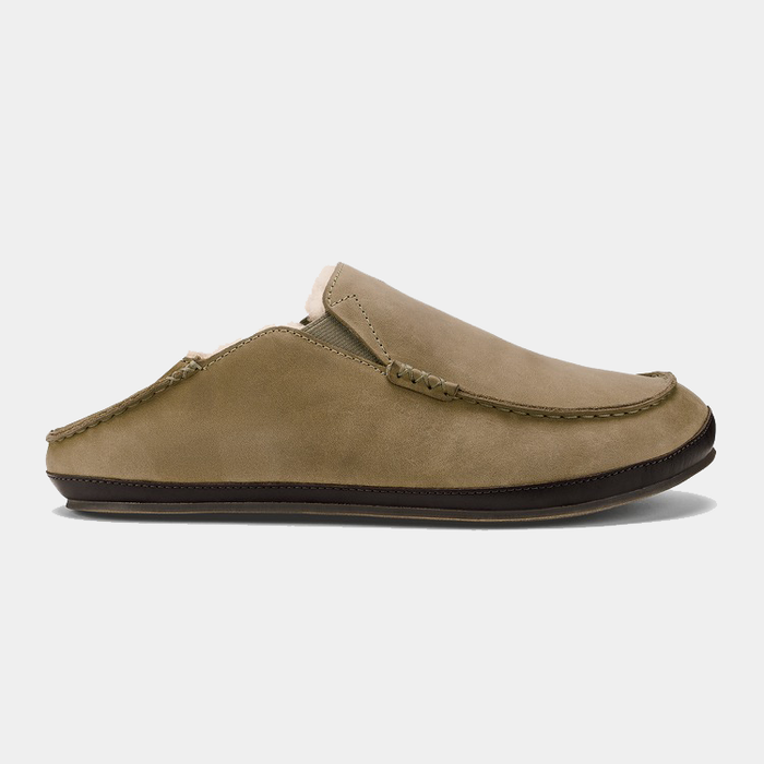 OluKai Moloa Slipper in tan suede with moc-toe stitching and a collapsible heel, side view.