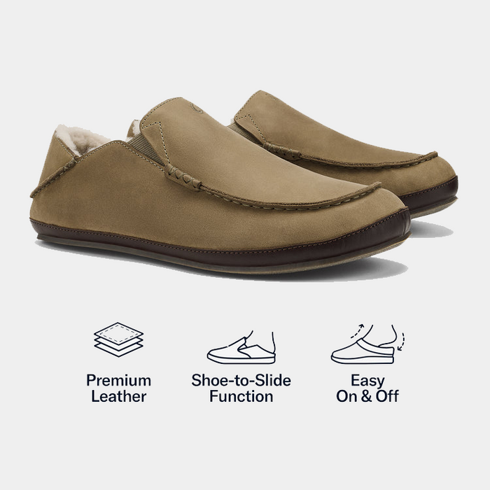 OluKai Moloa Slipper shoes in tan leather with soft lining, hand-sewn stitching, and foldable heel, side angled view.