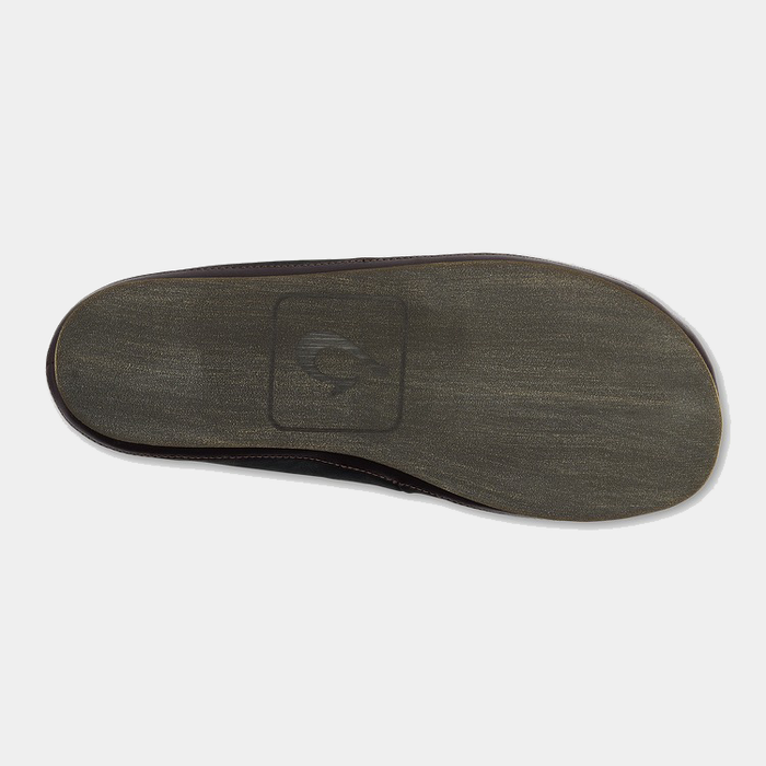 OluKai Moloa Slipper sole view showing textured brown outsole with logo imprint and subtle grip design.