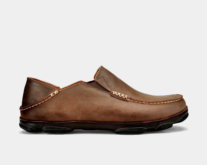 OluKai Moloa slip-on shoes in brown leather with contrast stitching and foldable heel, side view.