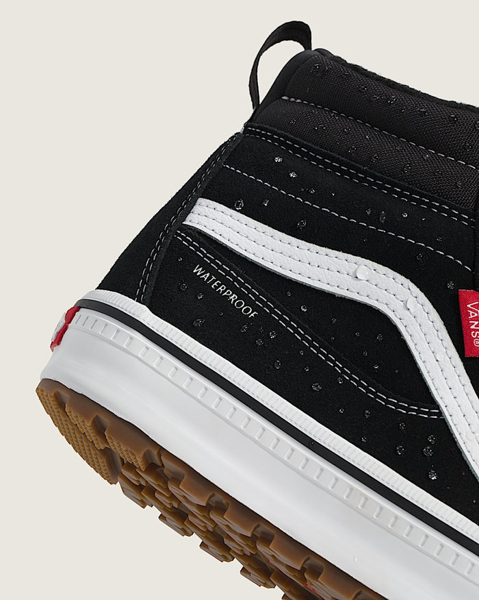 Vans MTE Sk8-Hi Waterproof Insulated Shoe, black upper with white stitching and stripe, rain-resistant material, close-up side view.