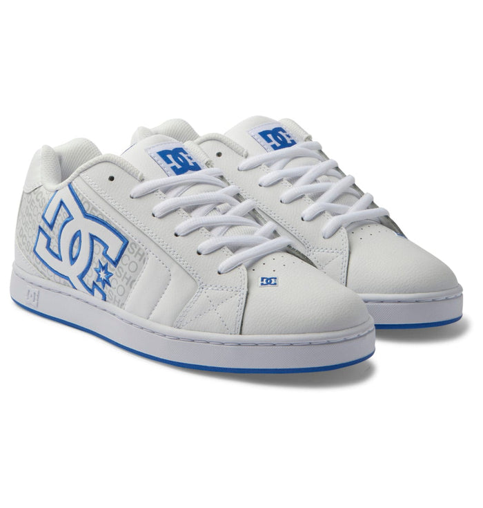 DC Footwear Net shoes in white leather with blue accents, oversized brand logo, and cushioned collar, angled front view.