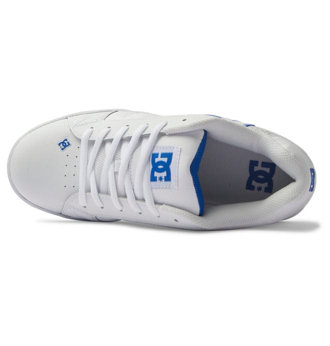 DC Footwear Net skate shoes in white with blue logo accents, padded tongue, mesh lining, and white laces, top view.