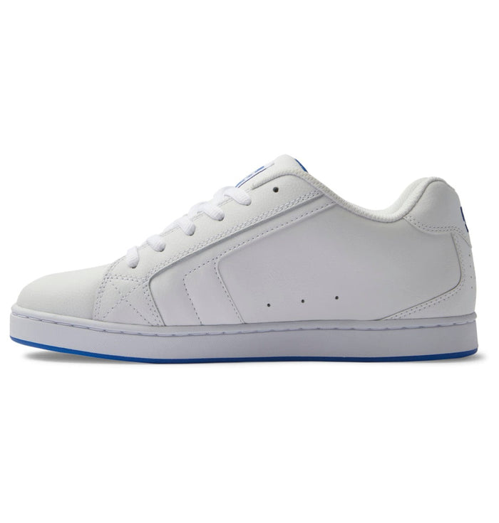 DC Footwear Net sneakers in white synthetic leather with perforations and blue accents, side profile view.