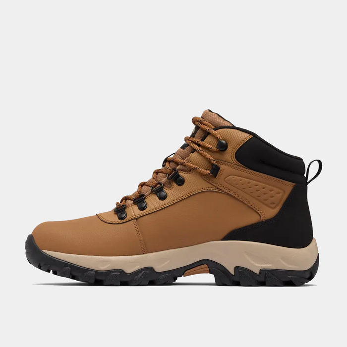 Columbia Newton Explorer hiking boots in tan and black with durable leather upper and rugged outsole, side view.